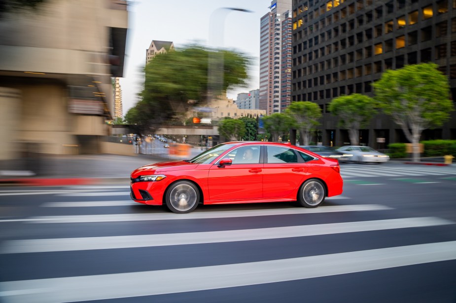 A 2023 Honda Civic, which looks a lot like a 2022 Honda Civic, cruises urban streets.