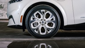 A white 2022 Mustang Mach E, which is one of the best electric SUVs to buy.