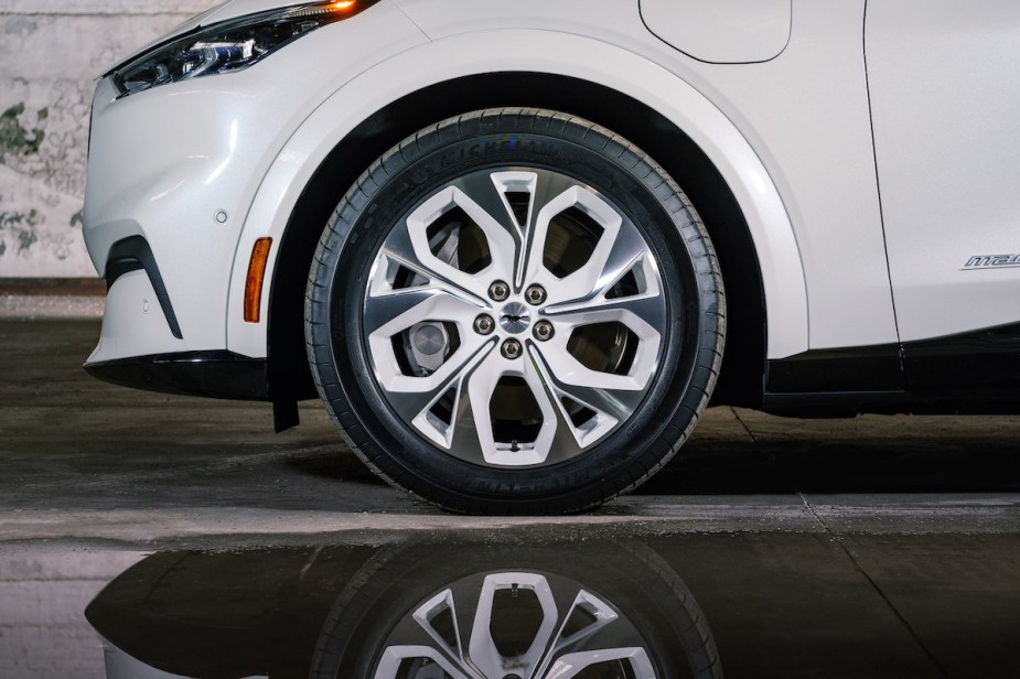 A white 2022 Mustang Mach E, which is one of the best electric SUVs to buy. 