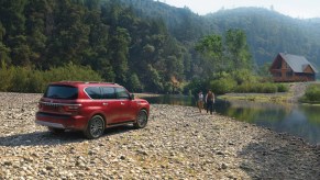 A 2022 Nissan Armada outside parked by a lake, desperately needs a redesign.