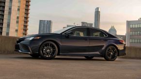 A 2022 Toyota Camry XSE midsize sedan in Blueprint parked on a city rooftop