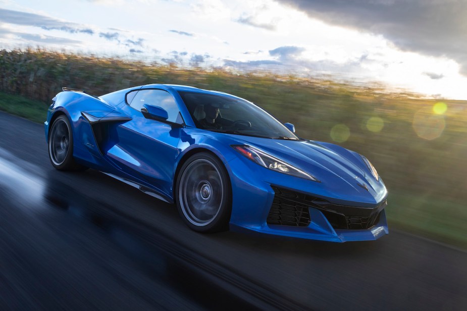 A 2023 Chevrolet Corvette Z06 in blue driving down a road. 