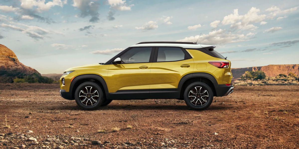 A yellow 2023 Chevy Trailblazer parked outside.