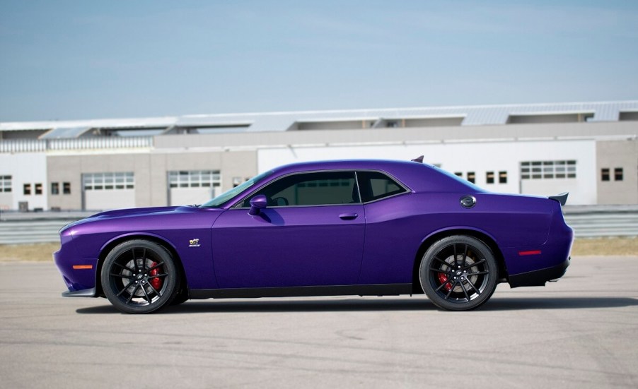 A Plum Crazy Purple 2023 Dodge Challenger shows off its side profile.