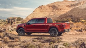 A red Ford F-150 parked in the desert, which is one of the fastest full-size trucks.