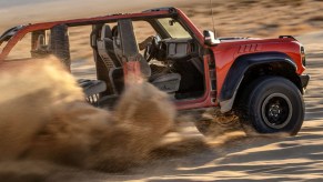 A 2023 Ford Bronco without doors ripping through the desert with no manual transmission.