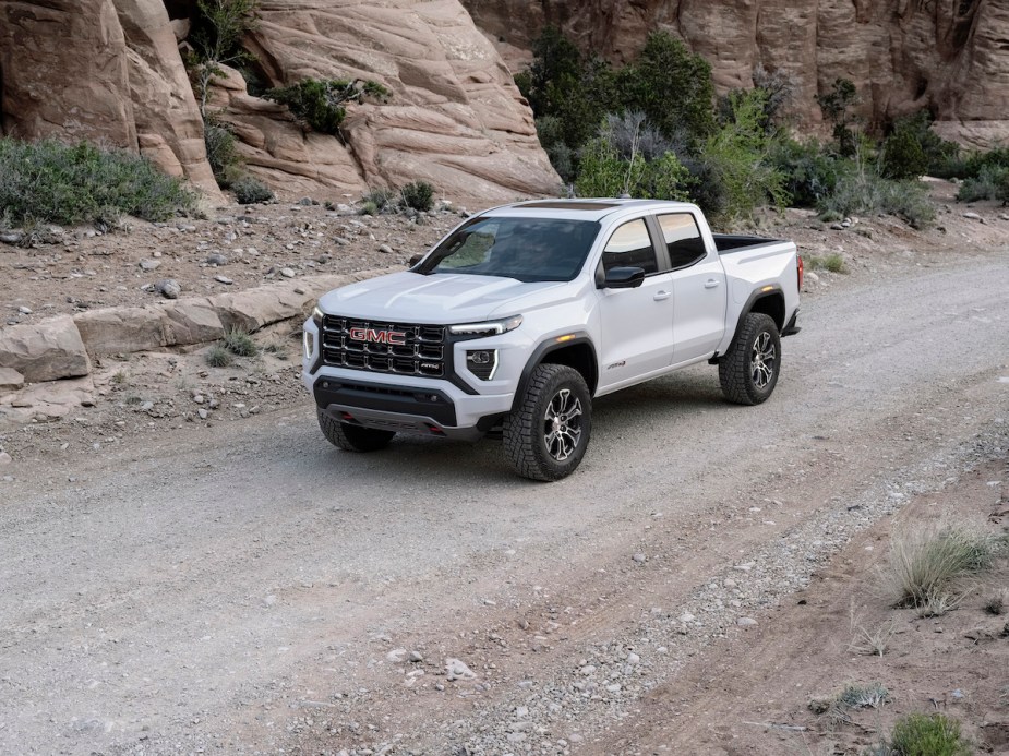 A white 2023 GMC Canyon outdoors. 