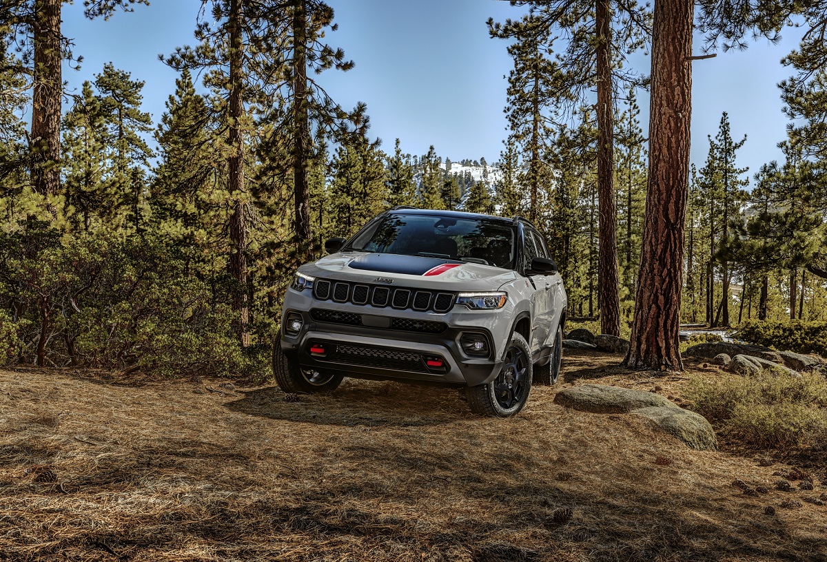 2023 Jeep Compass Trailhawk in silver in the woods