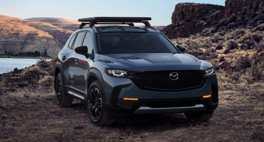 A blue 2023 Mazda CX-50 small SUV is parked outdoors. 