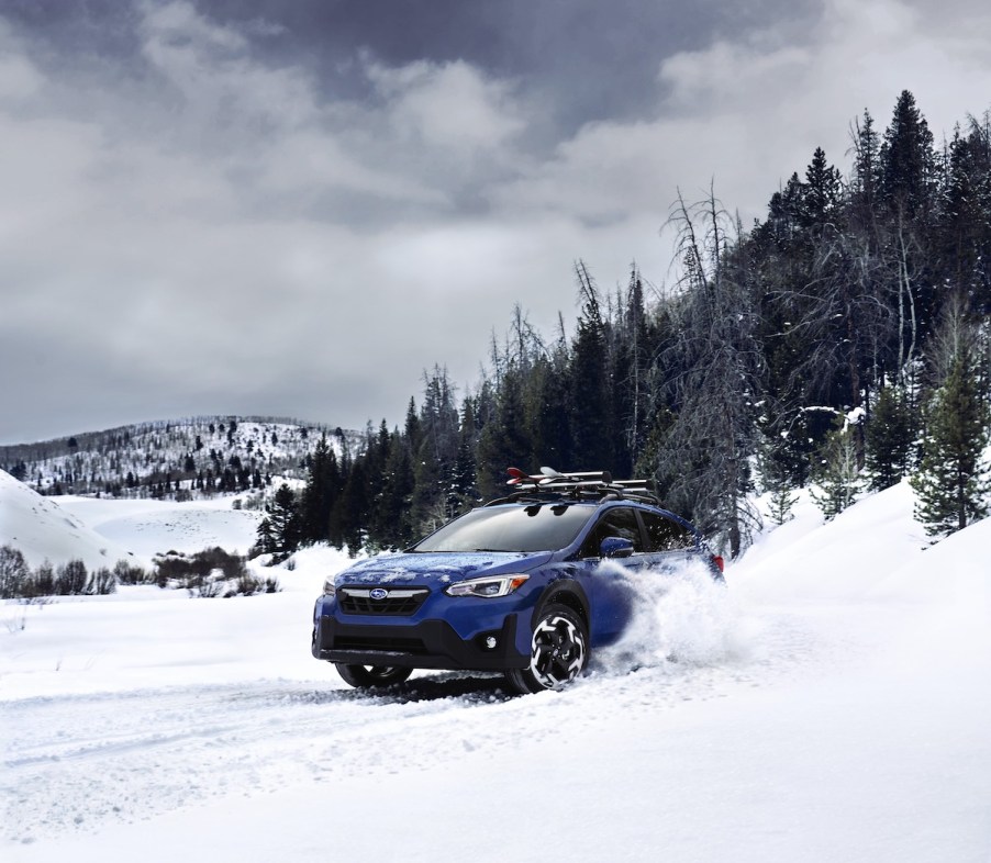 A blue 2023 Subaru Crosstrek, which is a 2023 SUV to buy in the snow.