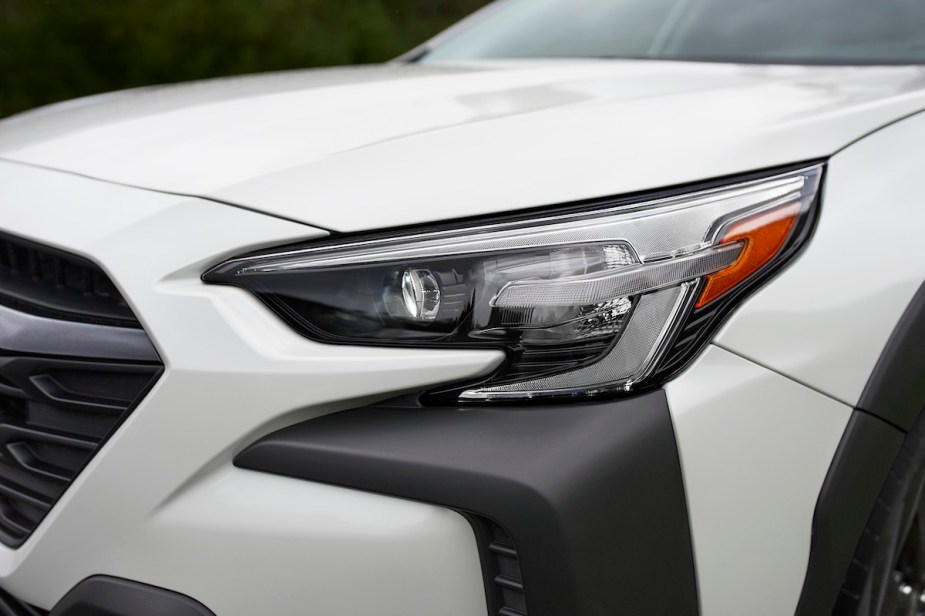 A white 2023 Subaru Outback, which is one of the best midsize SUVs to buy