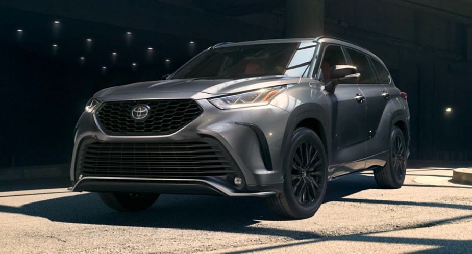 A gray 2023 Toyota Highlander midsize SUV is parked. 