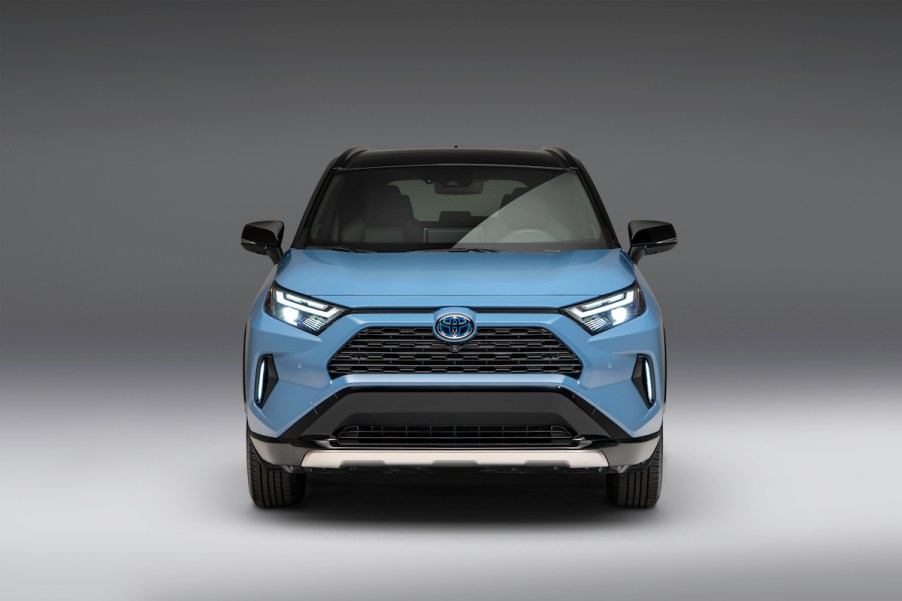 A light blue 2023 Toyota RAV4, which is the Toyota with the lowest insurance cost.