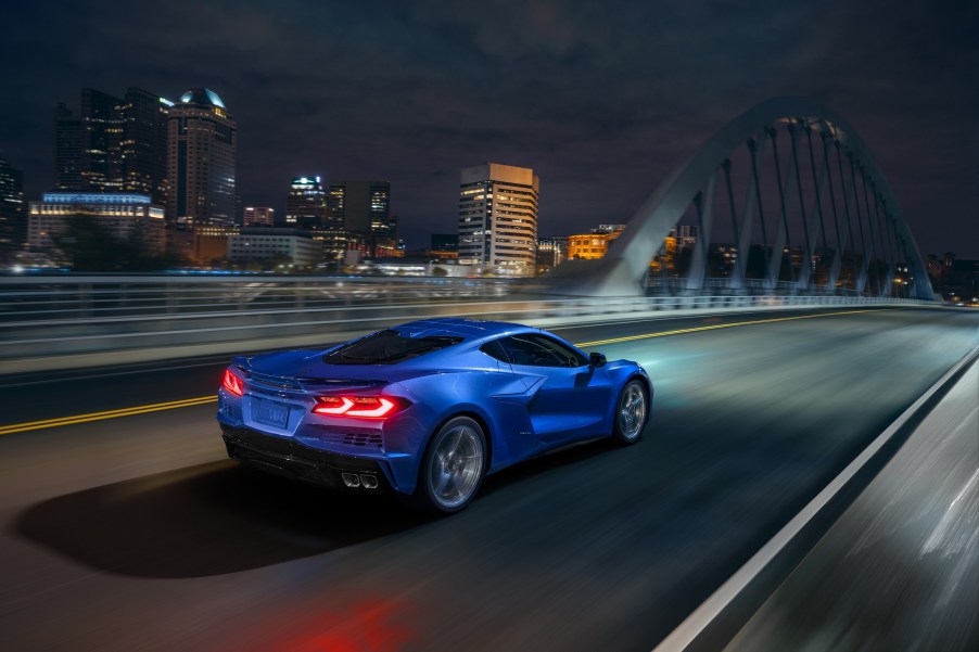 The new 2024 Chevrolet Corvette E-Ray blasts down an city bridge using its hybrid platform.