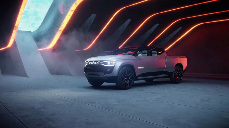 Promo photo of a Ram Revolution concept truck parked in a concrete structure, the sky visible through a window.