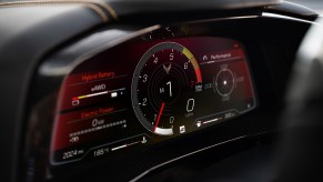 The 2024 Chevrolet Corvette E-Ray interior shows a digital display with access to driver modes.