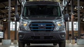 A Ford E-Transit delivery van in a warehouse.