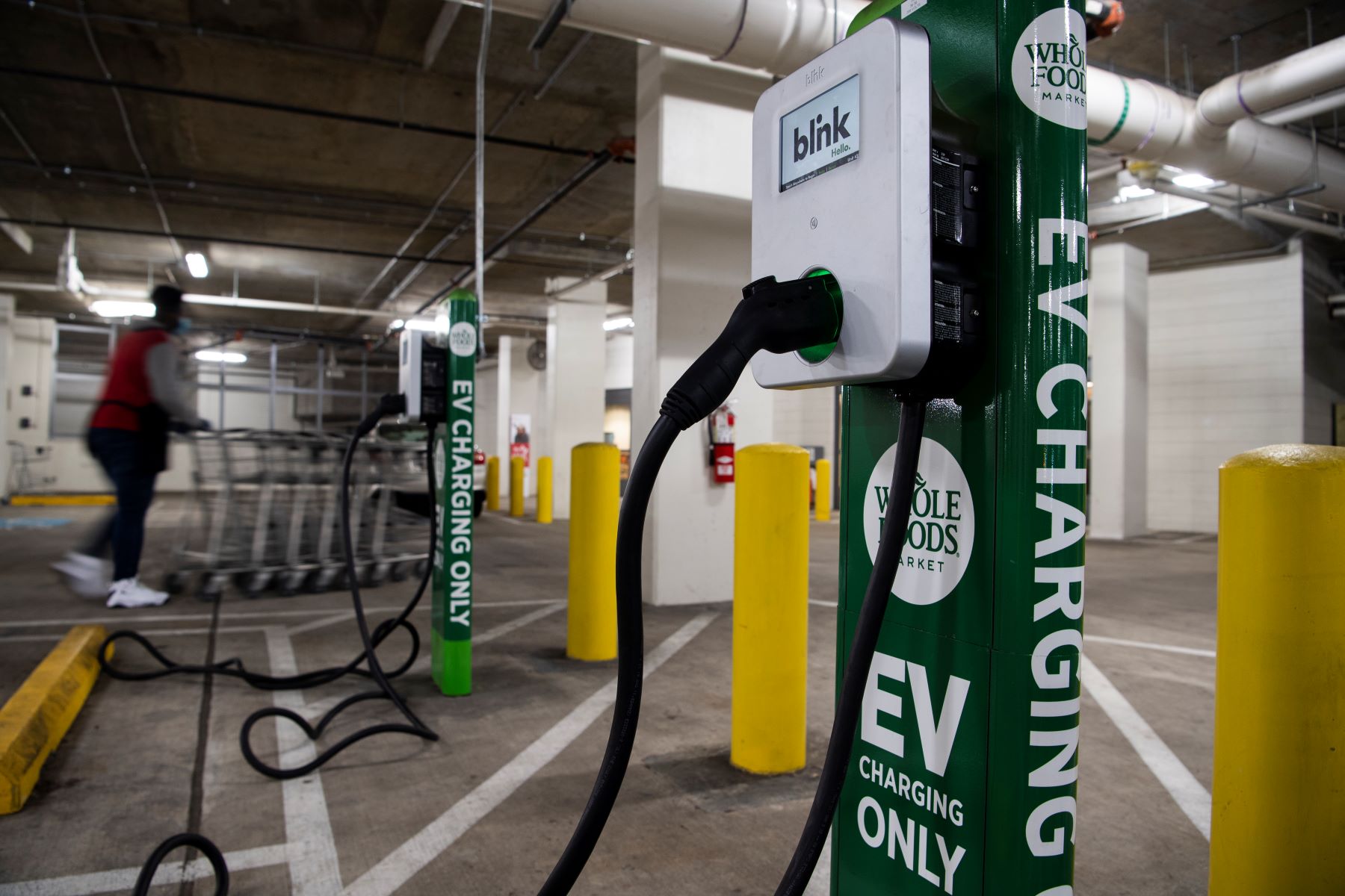 A Blink electric vehicle (EV) charging station at a Whole Foods parking garage in Washington, D.C.