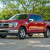 A red Ford F-150 parked outdoors where Ford F-150 insurance costs could be important.