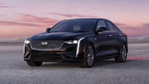 Front angle view of black 2023 Cadillac CT4, cheapest new Cadillac model and a luxury car bargain