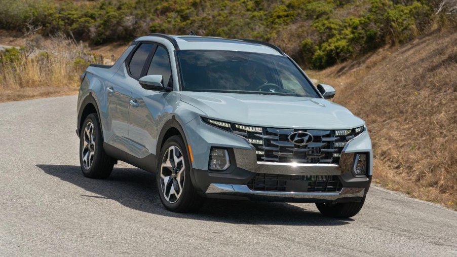 Front angle view of blue 2023 Hyundai Santa Cruz pickup truck