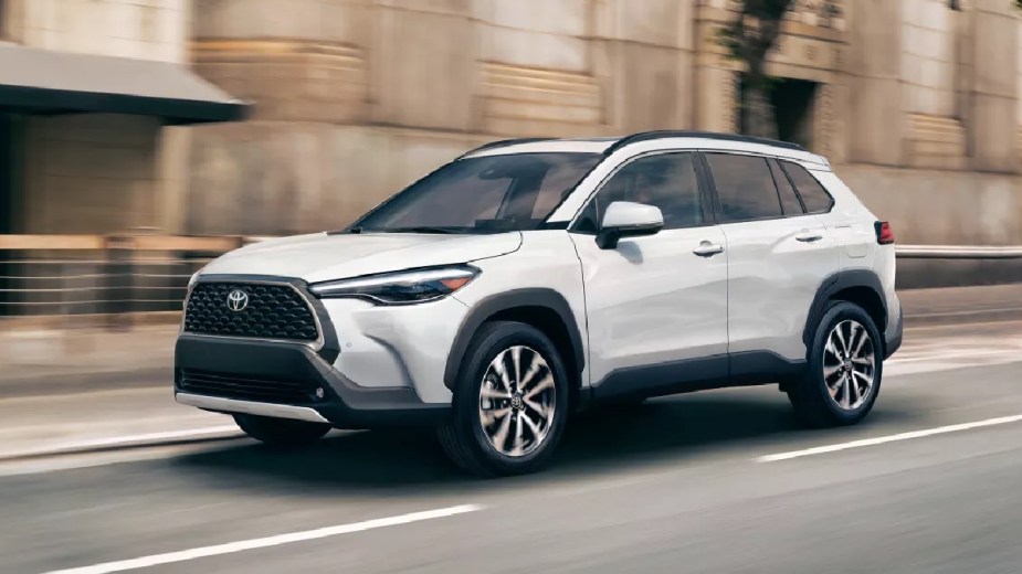 Front angle view of white 2023 Toyota Corolla Cross crossover SUV