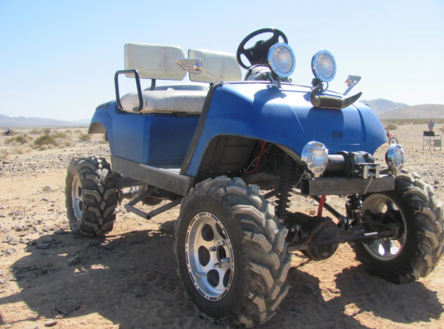 off-road golf cart in the dirt. How much do you have to spend to get a good golf cart?