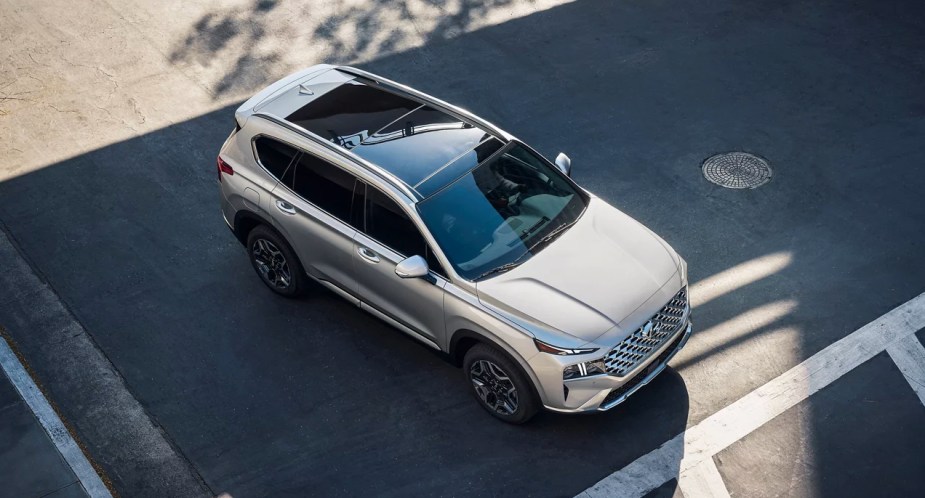 A gray 2023 Hyundai Santa Fe Plug-In Hybrid midsize plug-in hybrid SUV is parked. 