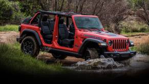 The Jeep Wrangler fording water while off-roading