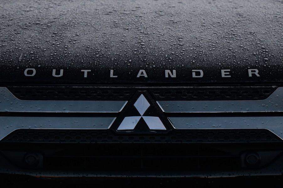 The hood of a Mitsubishi Outlander SUV model covered in rain in Dublin, Ireland