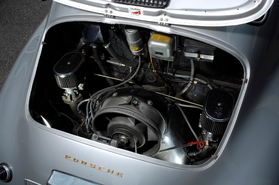 Bird's eye view of a Porsche 356 engine bay with its classic air cooled engine visible.