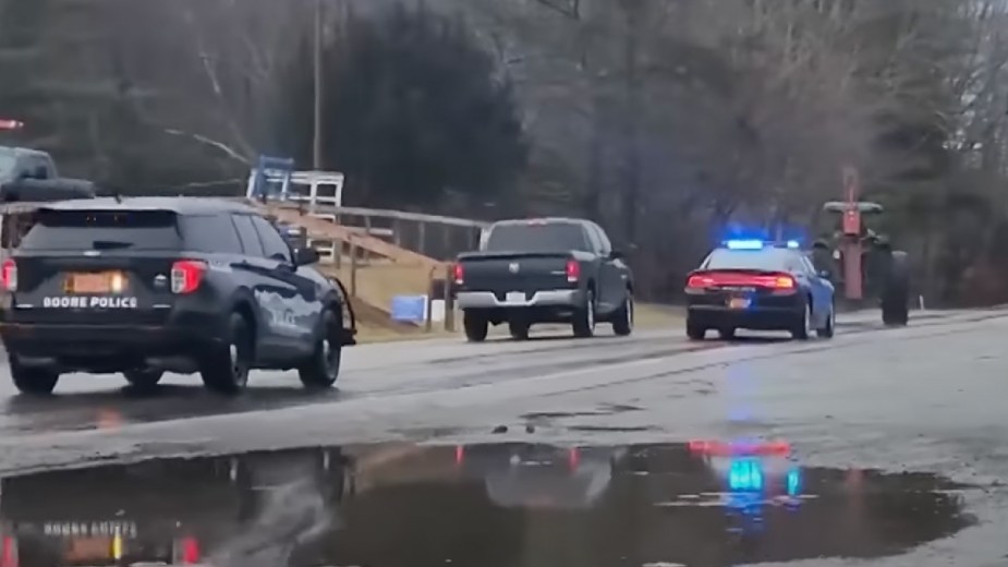 Ram pickup truck overtaking stolen John Deere farm tractor in police chase in Boone, North Carolina 