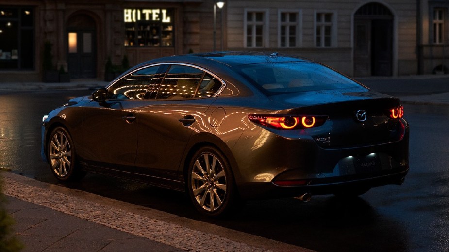 Rear angle view of gray 2023 Mazda3 compact car