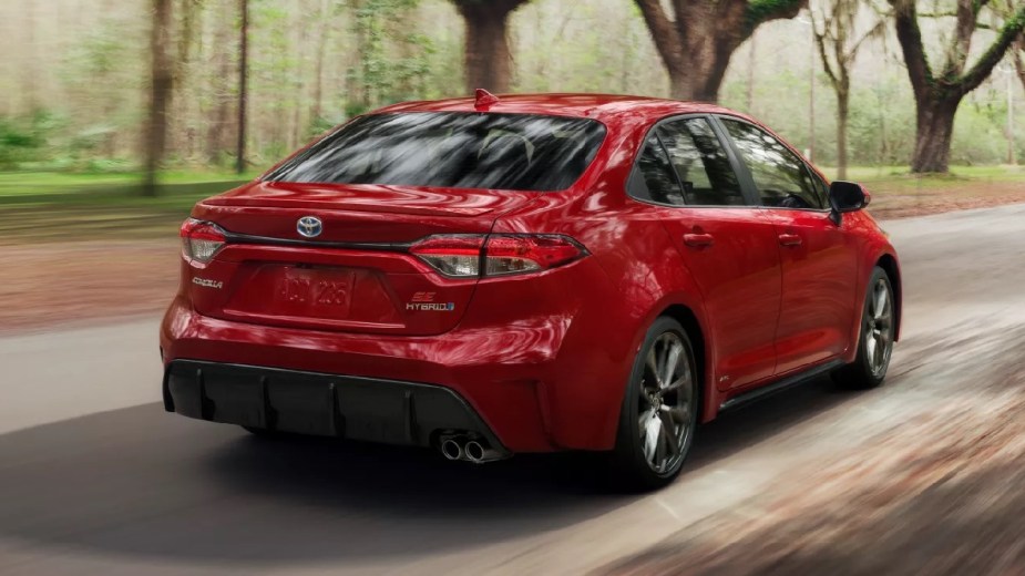 Rear angle view of red 2023 Toyota Corolla compact car