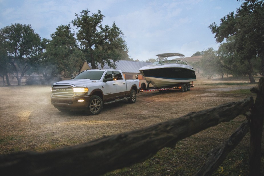 Promo photo of a heavy-duty Ram 2500 pickup truck towing a heavy boat.