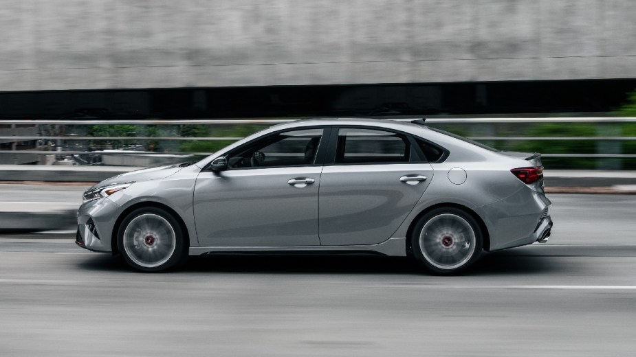 Side view of silver 2023 Kia Forte compact car