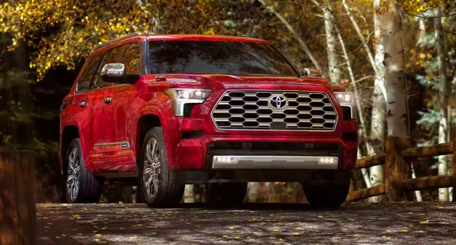 A red 2023 Toyota Sequoia full-size SUV is parked outdoors. 