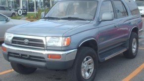 A 1996 Toyota 4Runner SUV sits in a parking lot. It is one of the most favored 4Runner models.