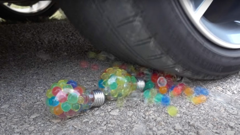 Vehicle drives over three light bulbs