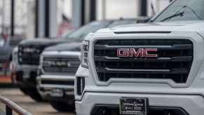 Closeup of the dealership license plate holder surround on a GMC SUV.