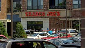 A Trader Joe's rear parking lot filled with cars in St. Louis Park, Minnesota