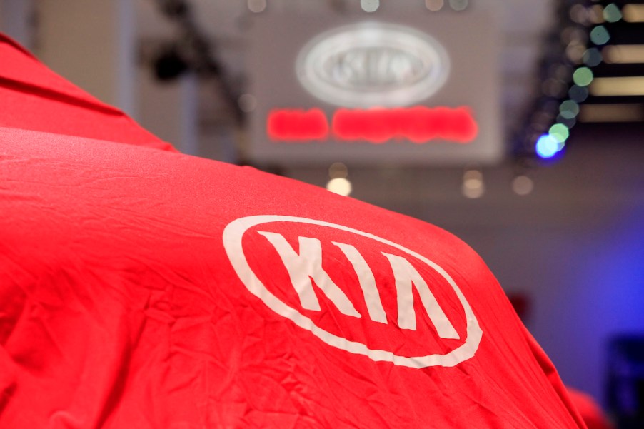 A Kia logo covering a car, which could be one of the most reliable Kia models.