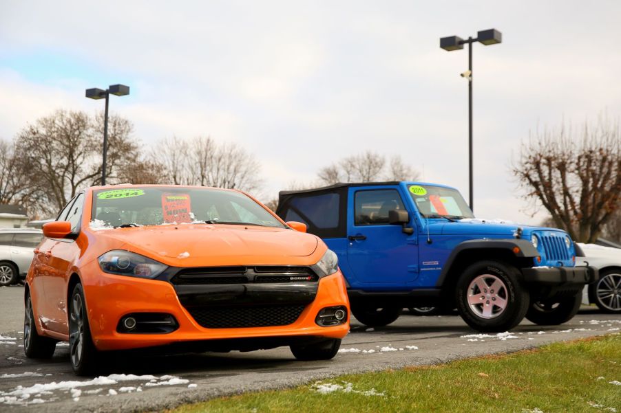 An orange used 2014 Dodge Dart compact sedan model for sale at the Eisenhauer Nissan dealership