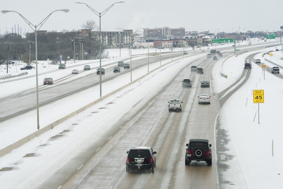 People driving during winter on a highway.