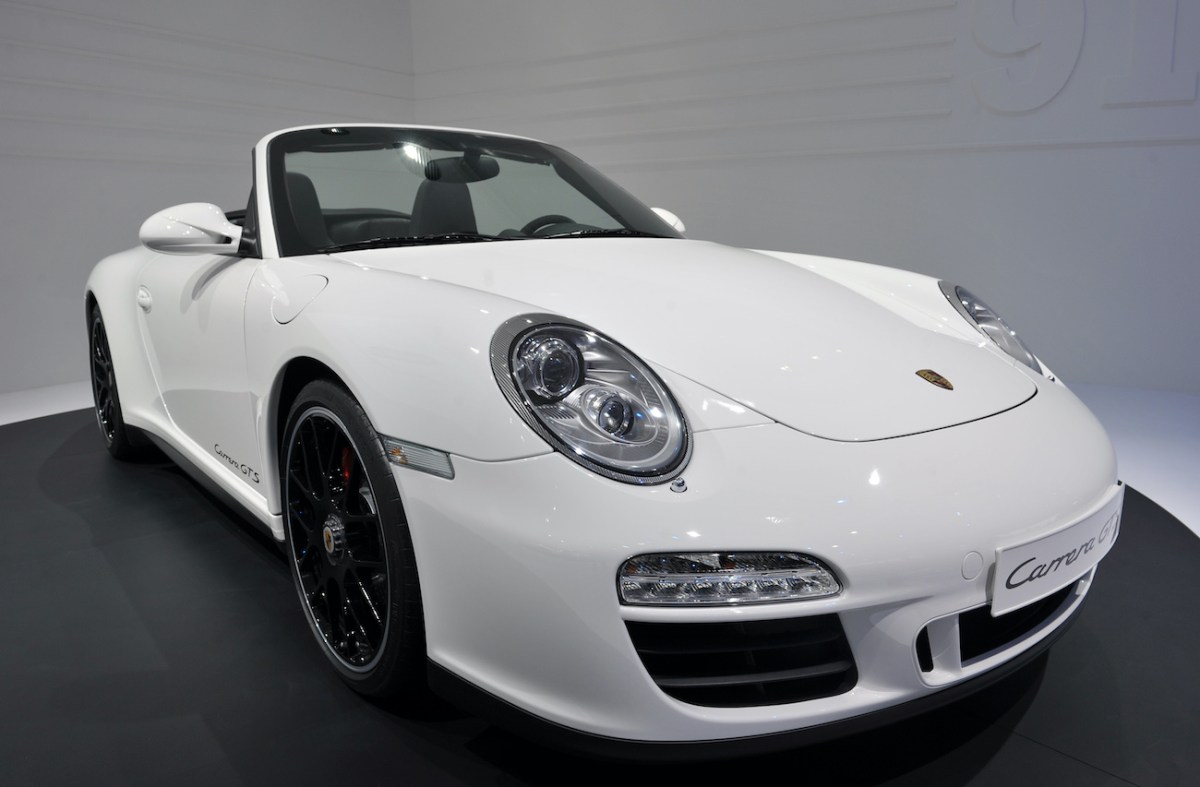 A white Porsche 911 Carrera GTS.