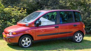 A red Fiat Multipla MPV model on display at the 2019 Concours d'Elegance at palace Soestdijk in Baarn, Netherlands