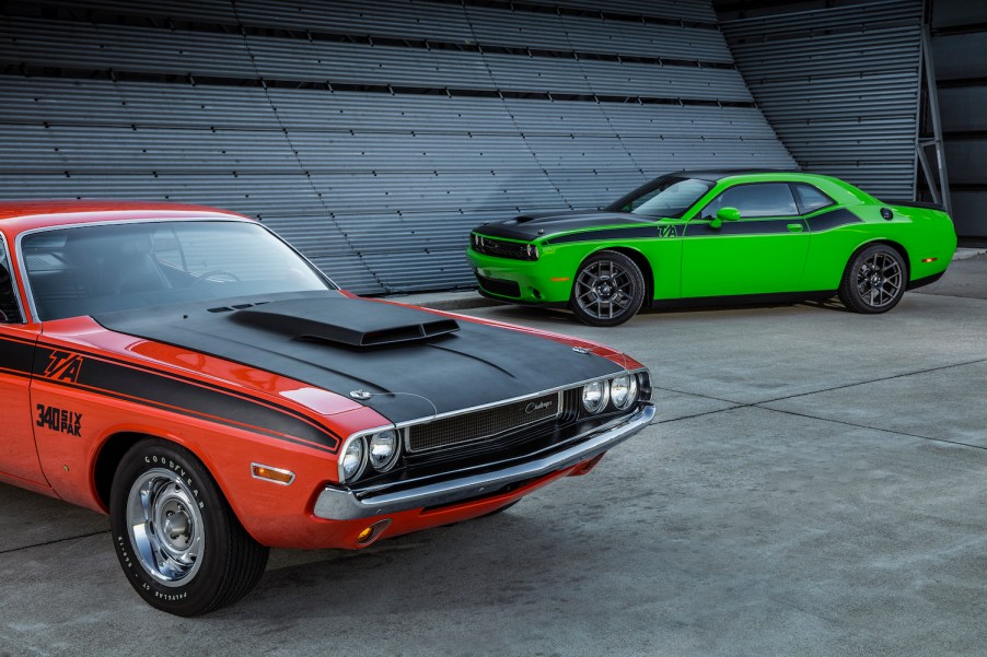 A red vintage Dodge Challenger is parked next to a new, green version of the T/A trim for a promo photo.