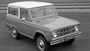 A 1970 Ford Bronco with a white roof