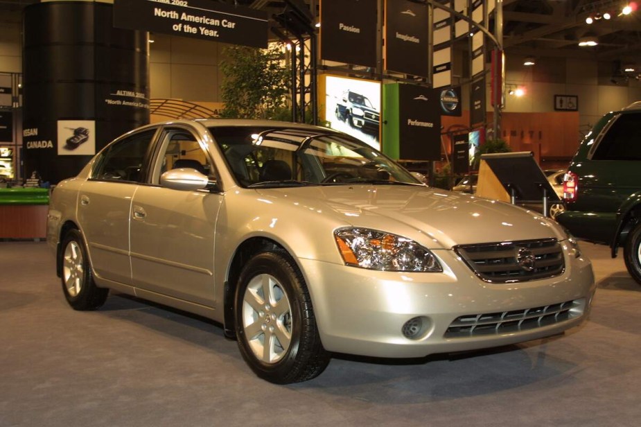 A gold color 2002 Nissan Altima. 