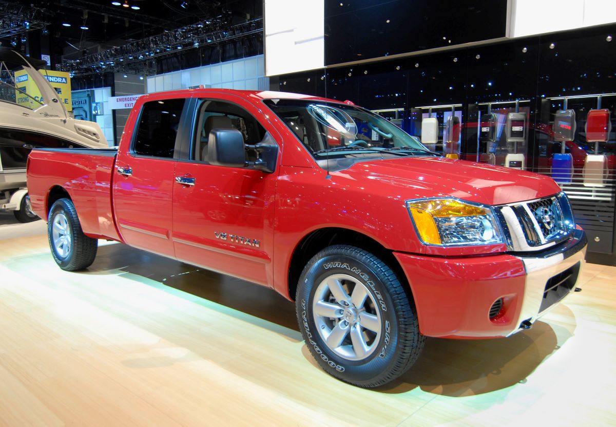 A red nissan titan at an auto show